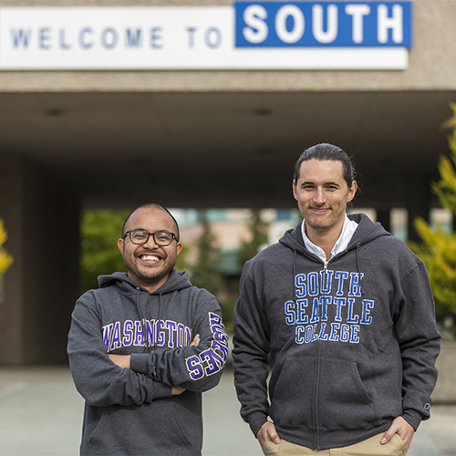 Two students, one in UW sweatshirt one in South Seattle College