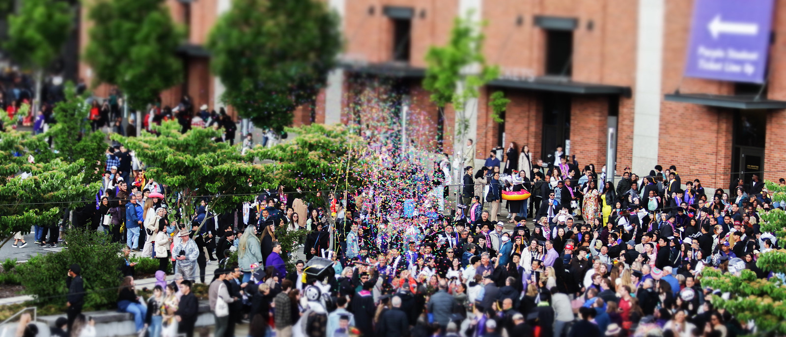 Students and families celebrate outside of Husky Stadium